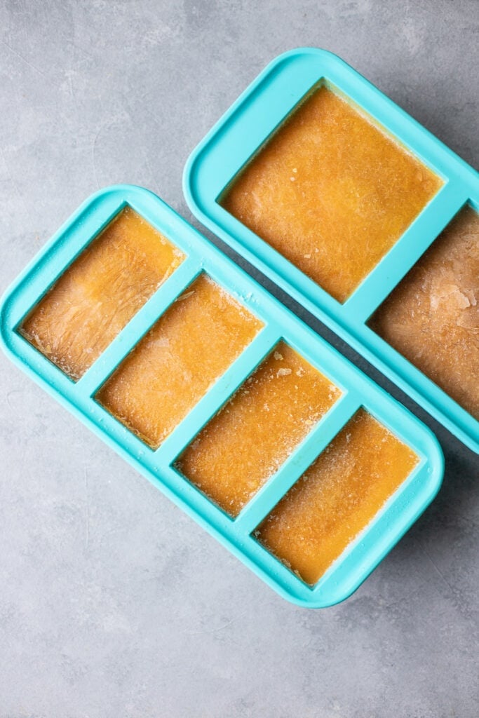 An overhead image of Souper Cubes filled with soup and frozen