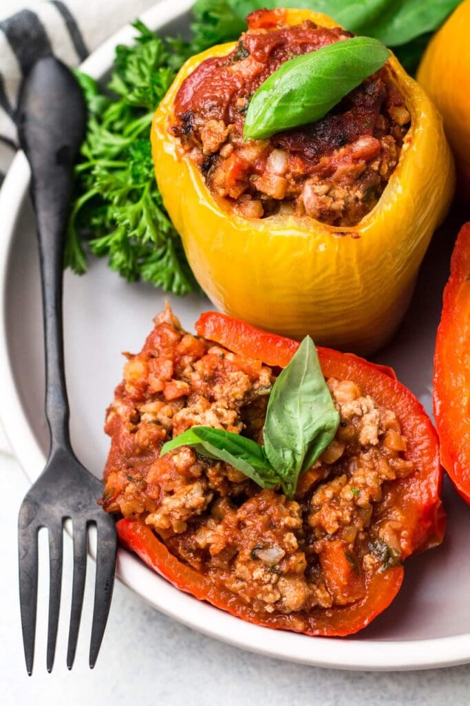 Whole30 crockpot stuffed peppers on a white plate