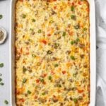 A white baking dish of egg hash brown casserole