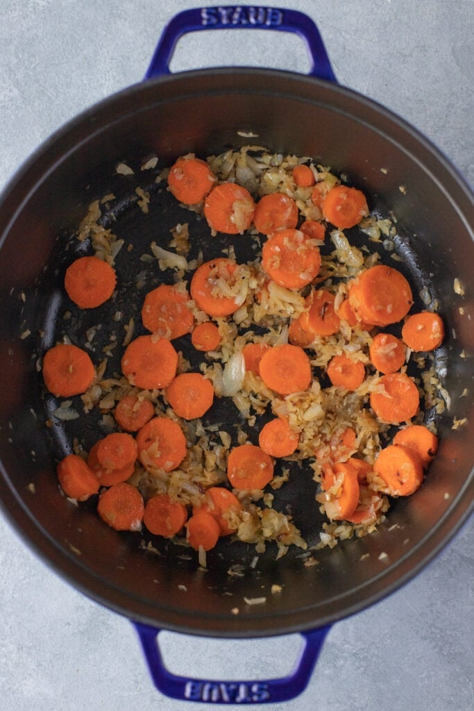 Sautéd onions, garlic and carrots in olive oil in a stock pot