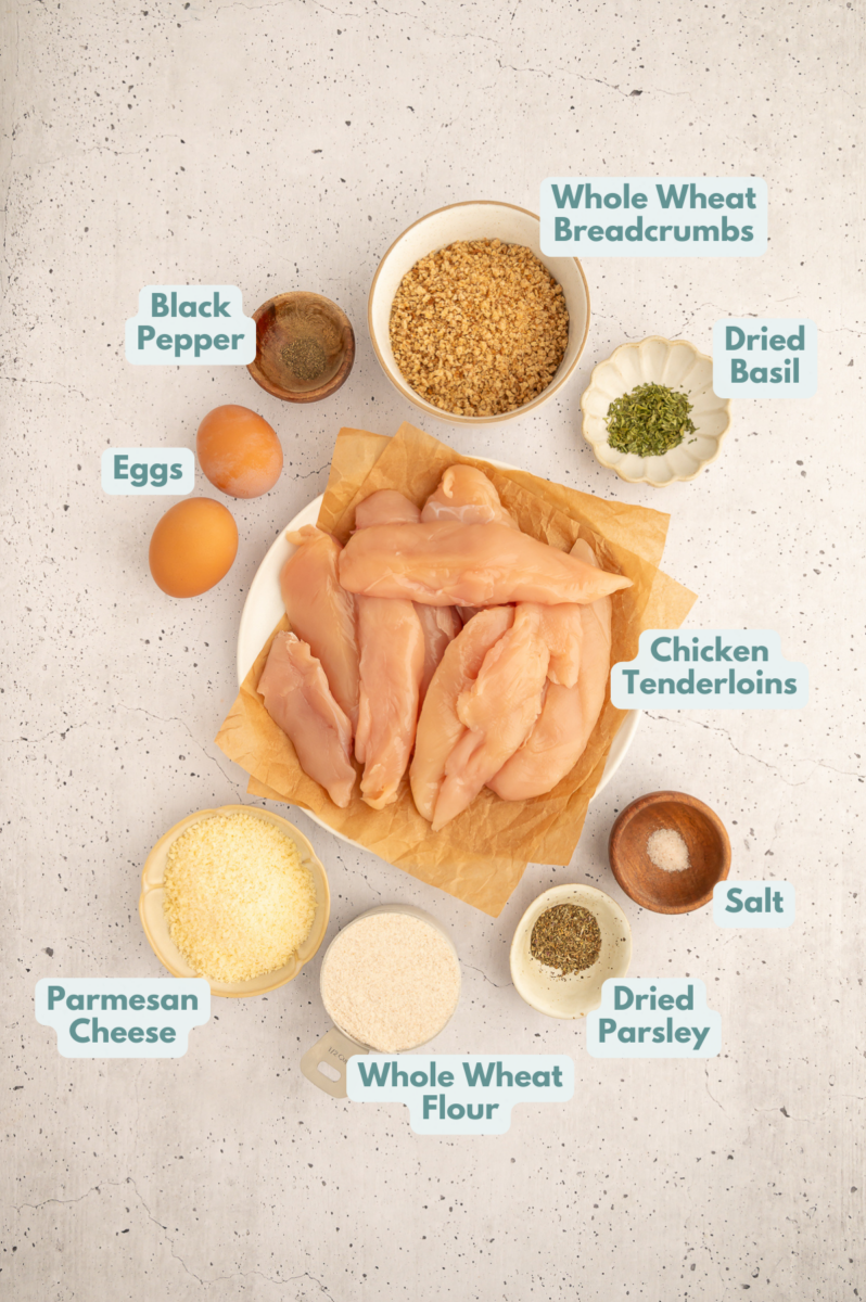 Ingredients for how to make healthy chicken tenders laid out in small white bowls