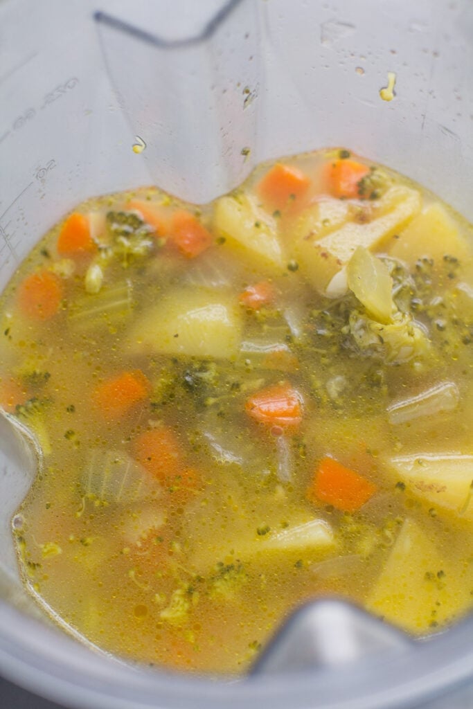 cooked broccoli soup being blended up