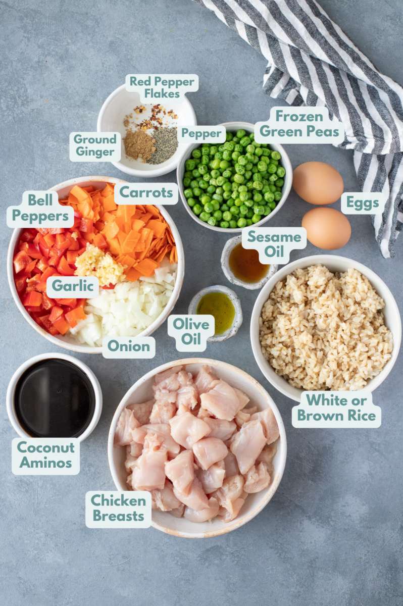 Ingredients for Healthy Fried Rice in small white bowls on a grey background