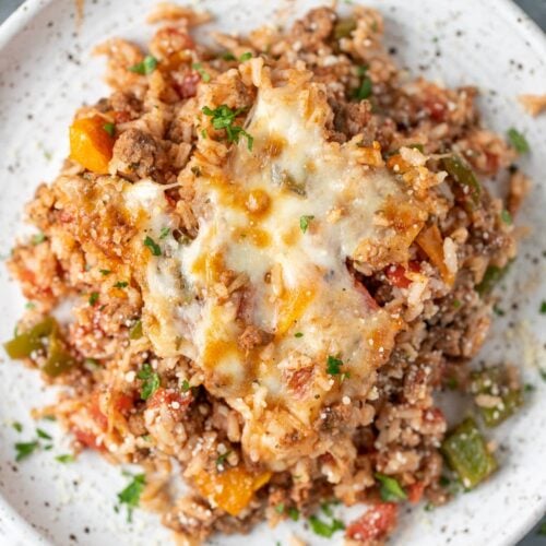 An overhead shot of stuffed pepper casserole on a white plate