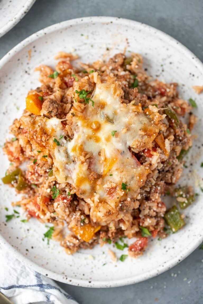 An overhead shot of stuffed pepper casserole on a white plate