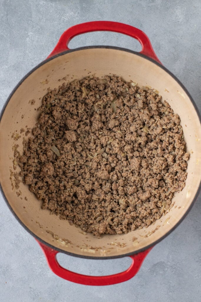 Browned ground beef, onion, and garlic in olive oil in a stock pot for taco soup