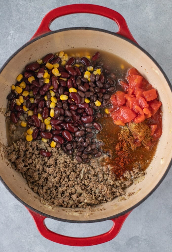 All ingredients for taco soup in a stock pot before being cooked and unmixed