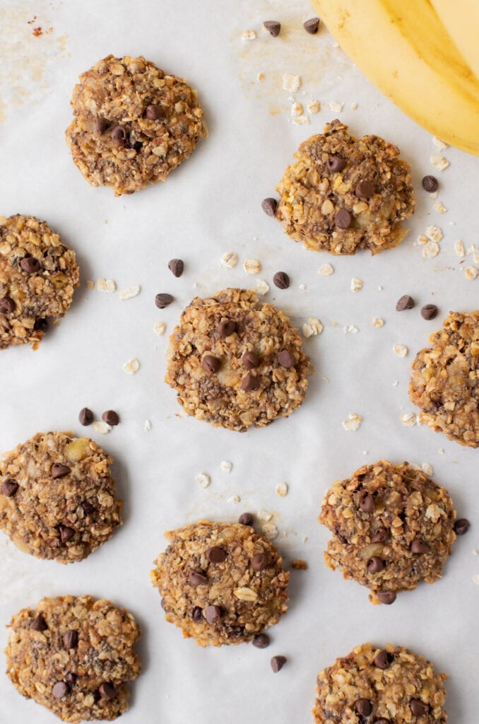 Healthy banana cookies on a white background with bananas on the side
