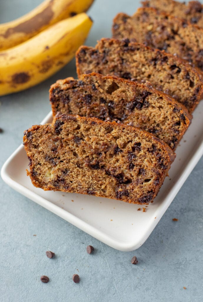 Healthy Banana Bread sliced on a white dish