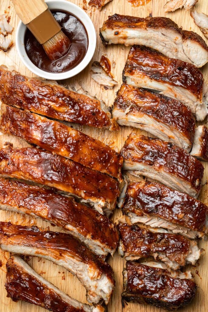 A close up of game day ribs on a cutting board