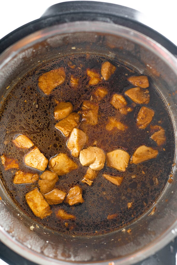 Instant pot orange chicken in the pressure cooker after it has been cooked