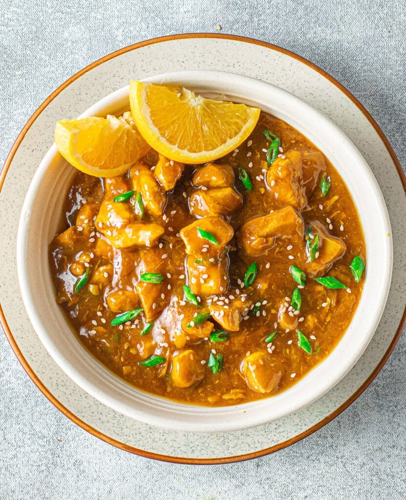 A close up of a bowl of instant pot orange chicken . a healthy dinner recipe