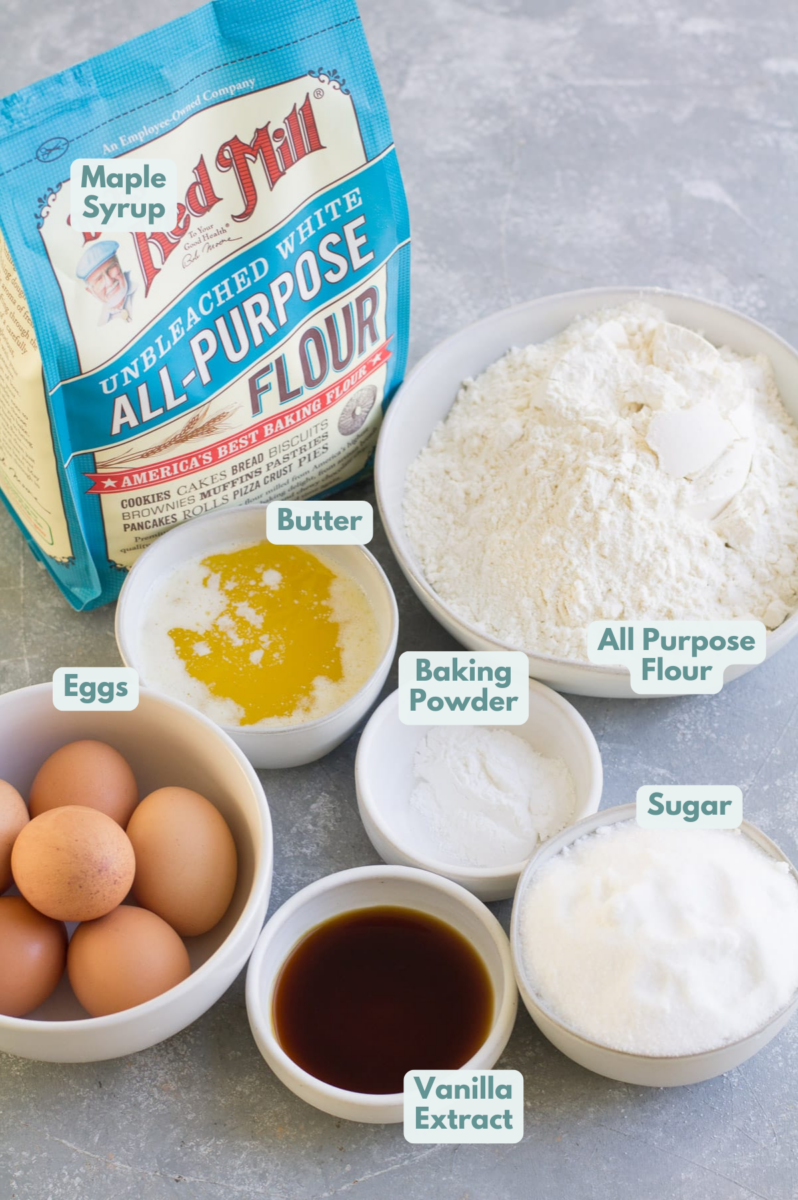 Ingredients for Pizzelle Cookies in small white bowls on a grey background