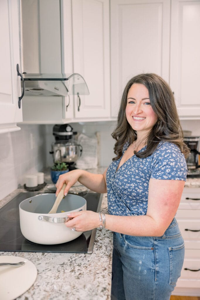 Clean Eating Couple stirring a caraway pan pot