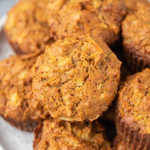 A white plate filled with healthy carrot muffins