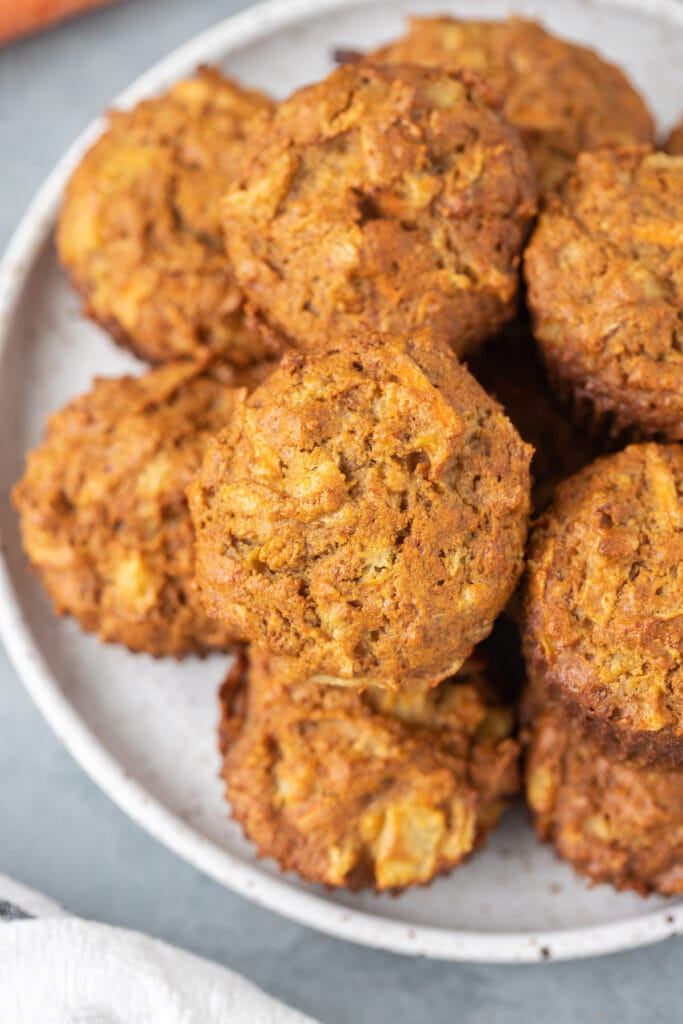 A close up of healthy carrot muffins on a white plate