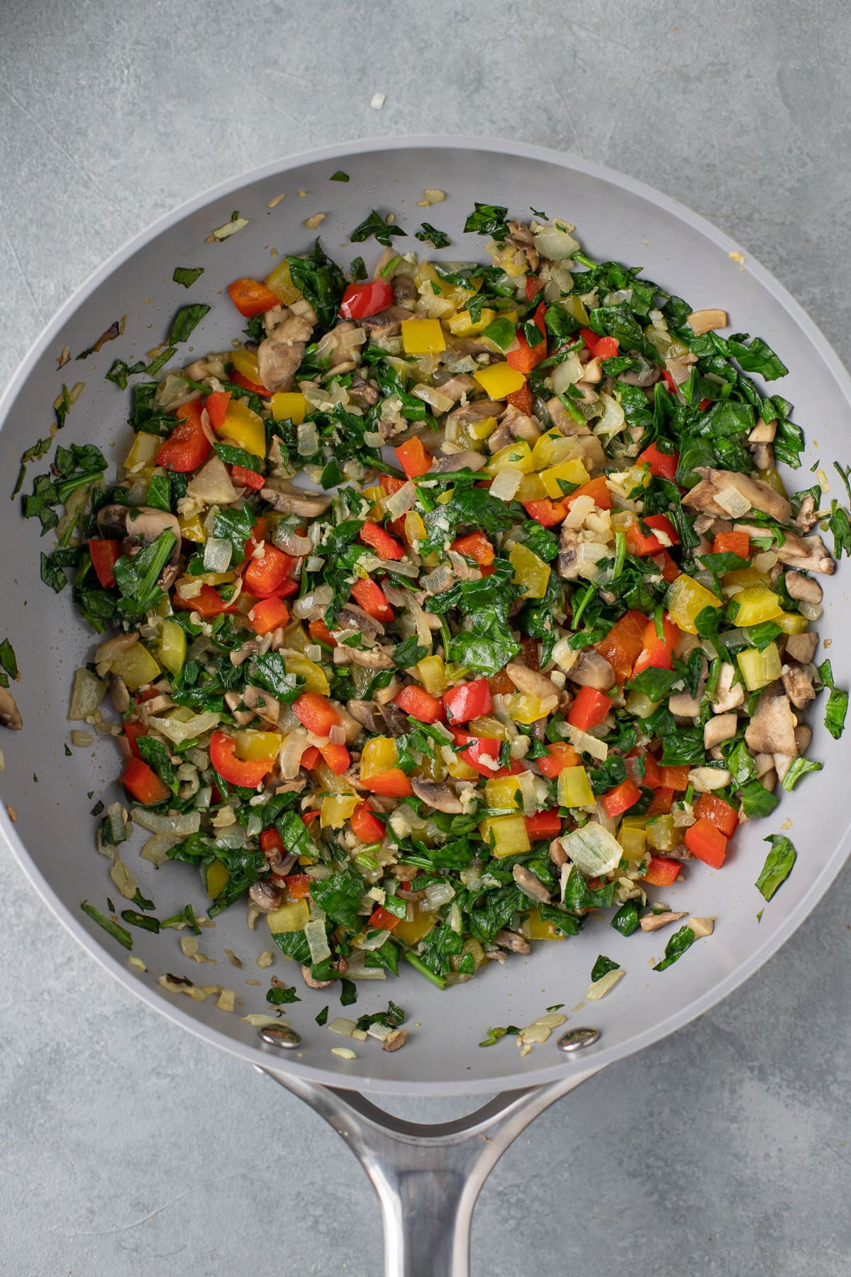 sauteed veggies in a pan for healthy egg casserole