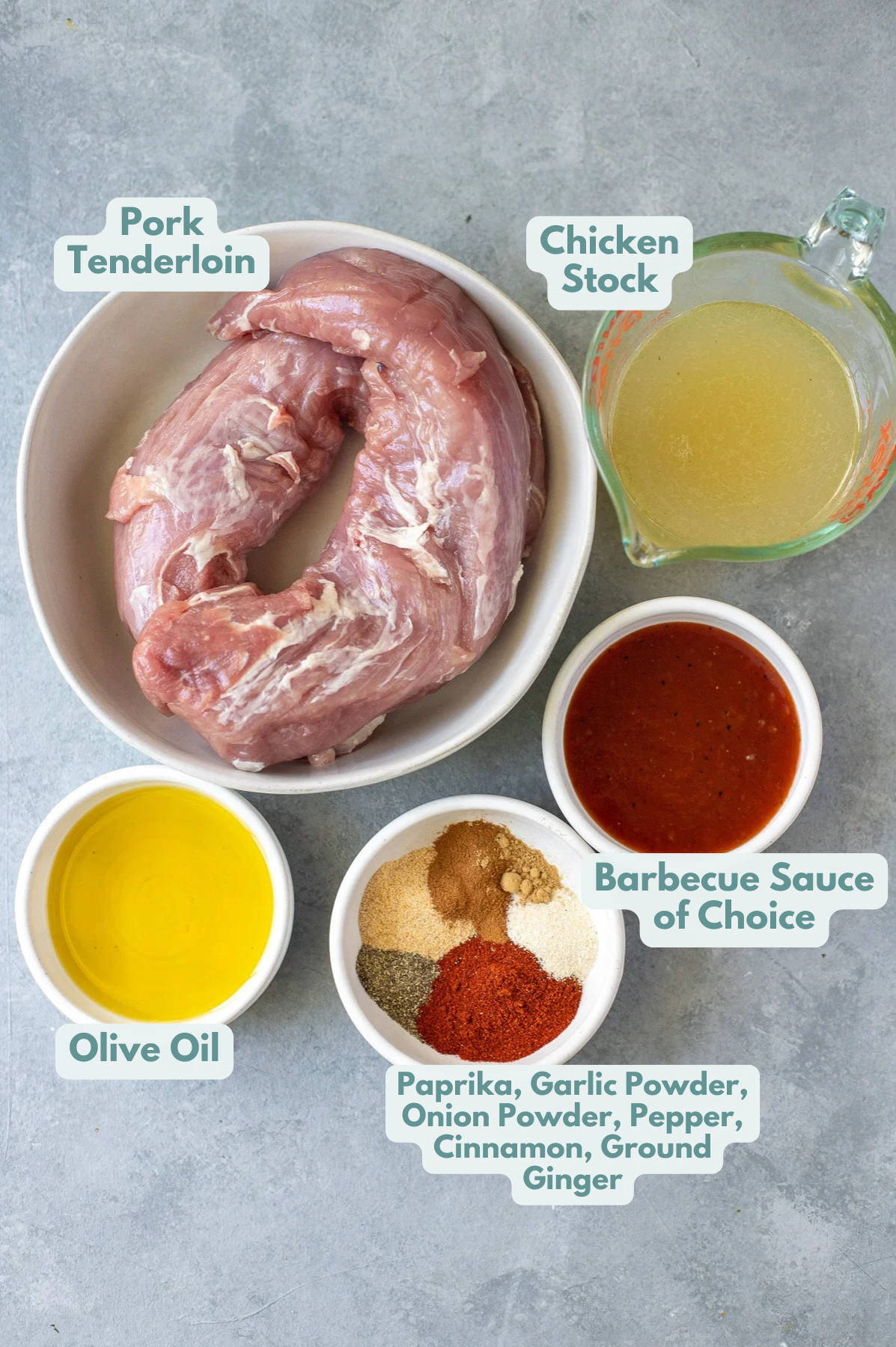 Ingredients for healthy pulled pork in small white bowls on a grey background