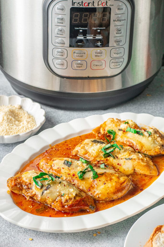 a white platter of keto chicken parmesan with an instant pot in the background