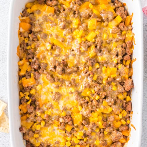 An overhead shot of taco ground beef casserole in a white dish