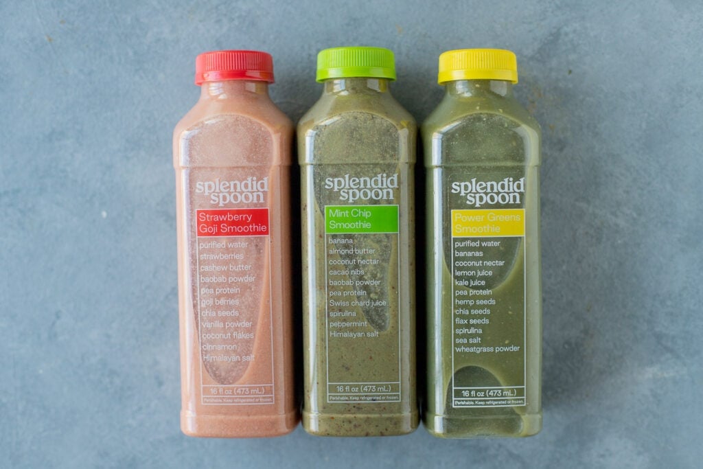 a close up of splendid spoon smoothies on a grey background