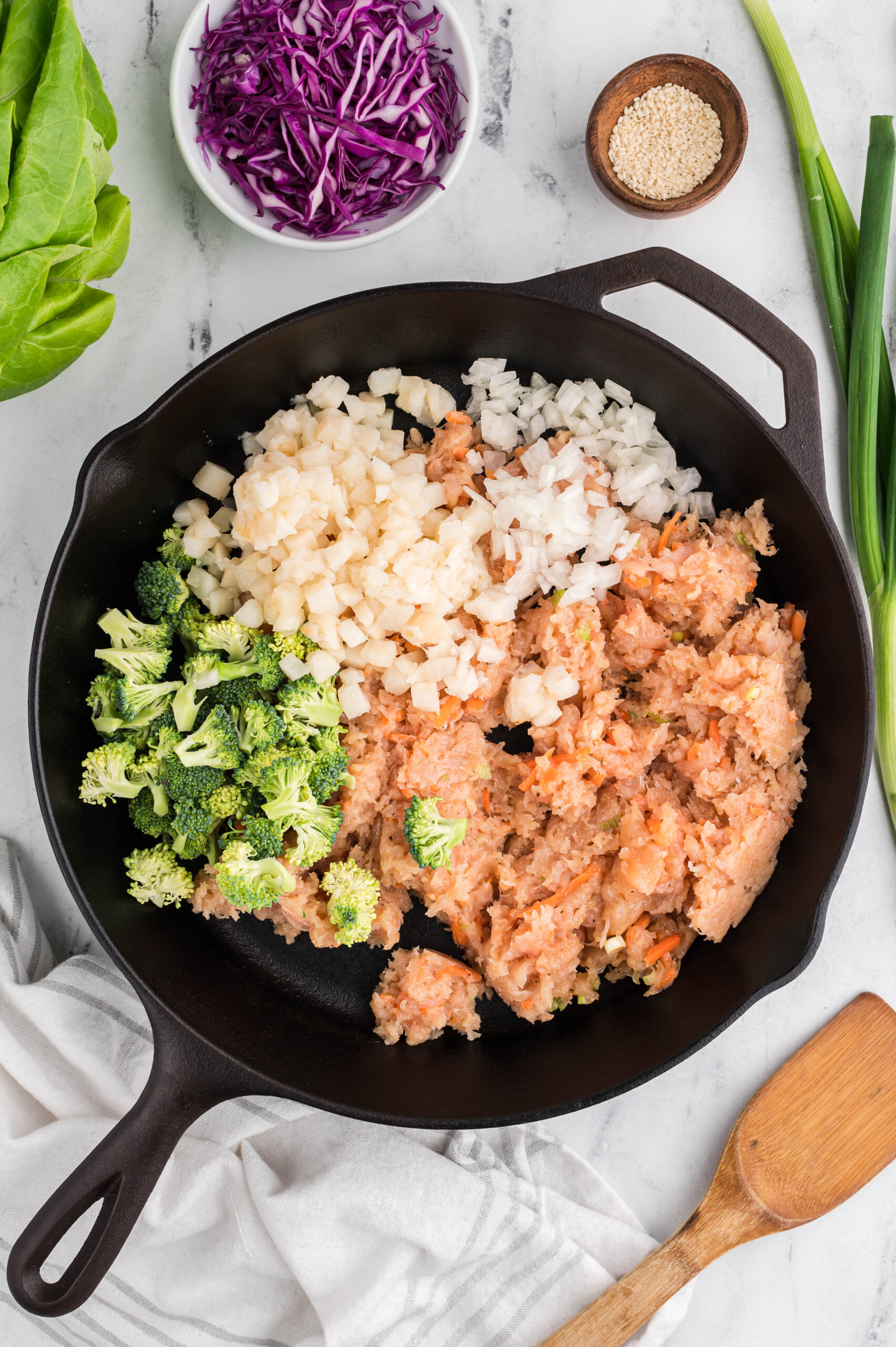 A pan of ingredients for chicken mixture of chicken lettuce wraps before being mixed or cooked