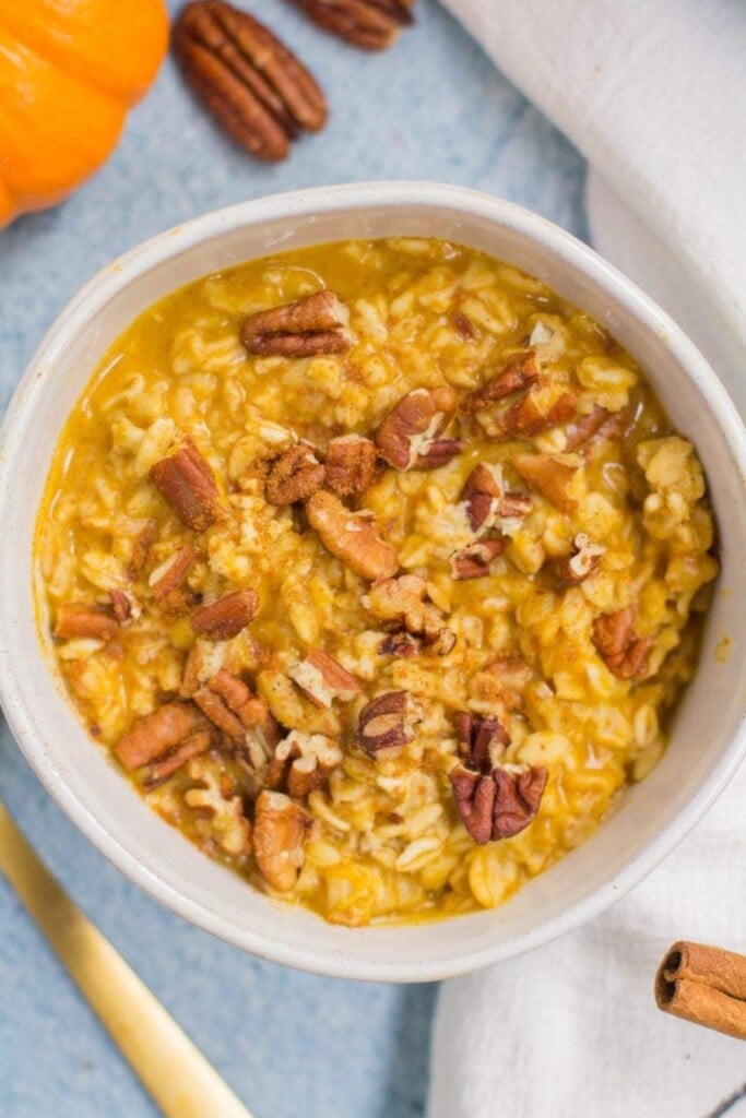 A close up of pumpkin overnight oats in a white bowl