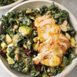 The Best Kale Salad recipe in a grey bowl on a grey background