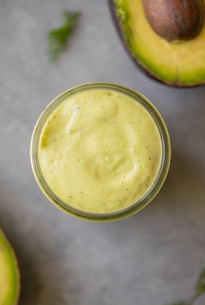 Avocado ranch dressing in a glass container