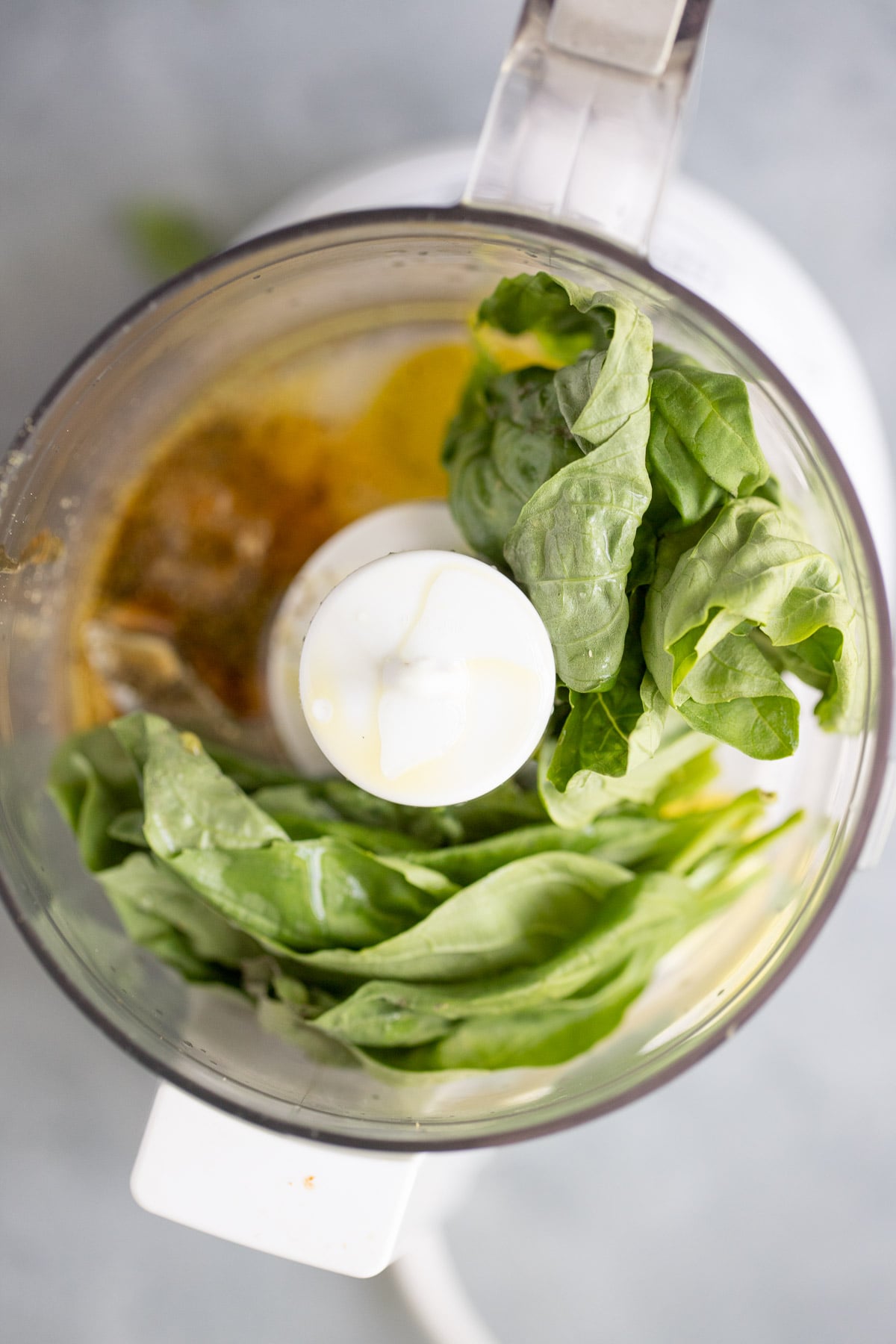 Basil Dressing in a food processor before being blended up