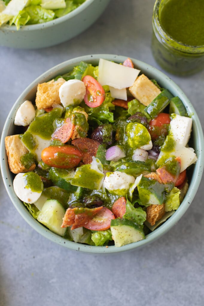 Basil Vinaigrette on a chopped salad with croutons, cheese and tomatoes