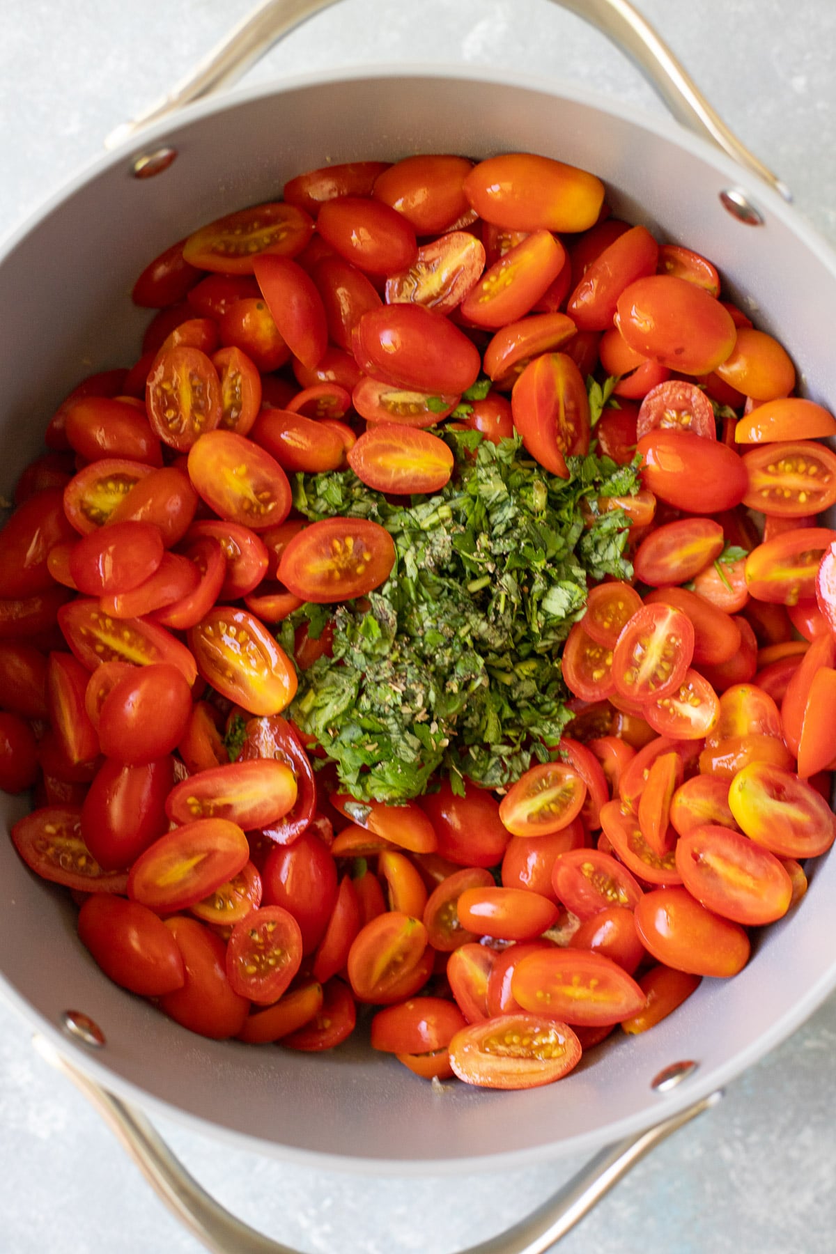 ingredients for cherry tomato sauce in a pot before being cooked or stirred