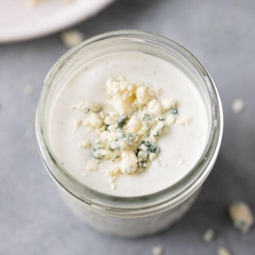 A close up of healthy blue cheese dressing in a glass jar