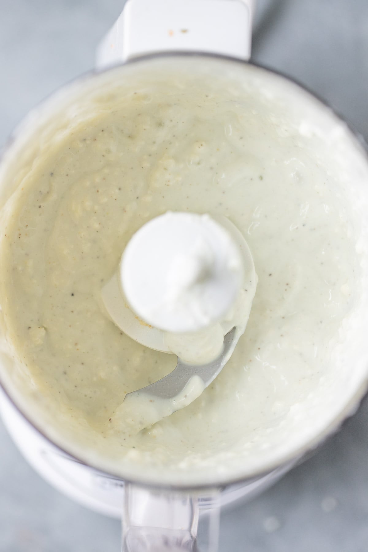 A close up of low fat blue cheese dressing in a food processor before being blended