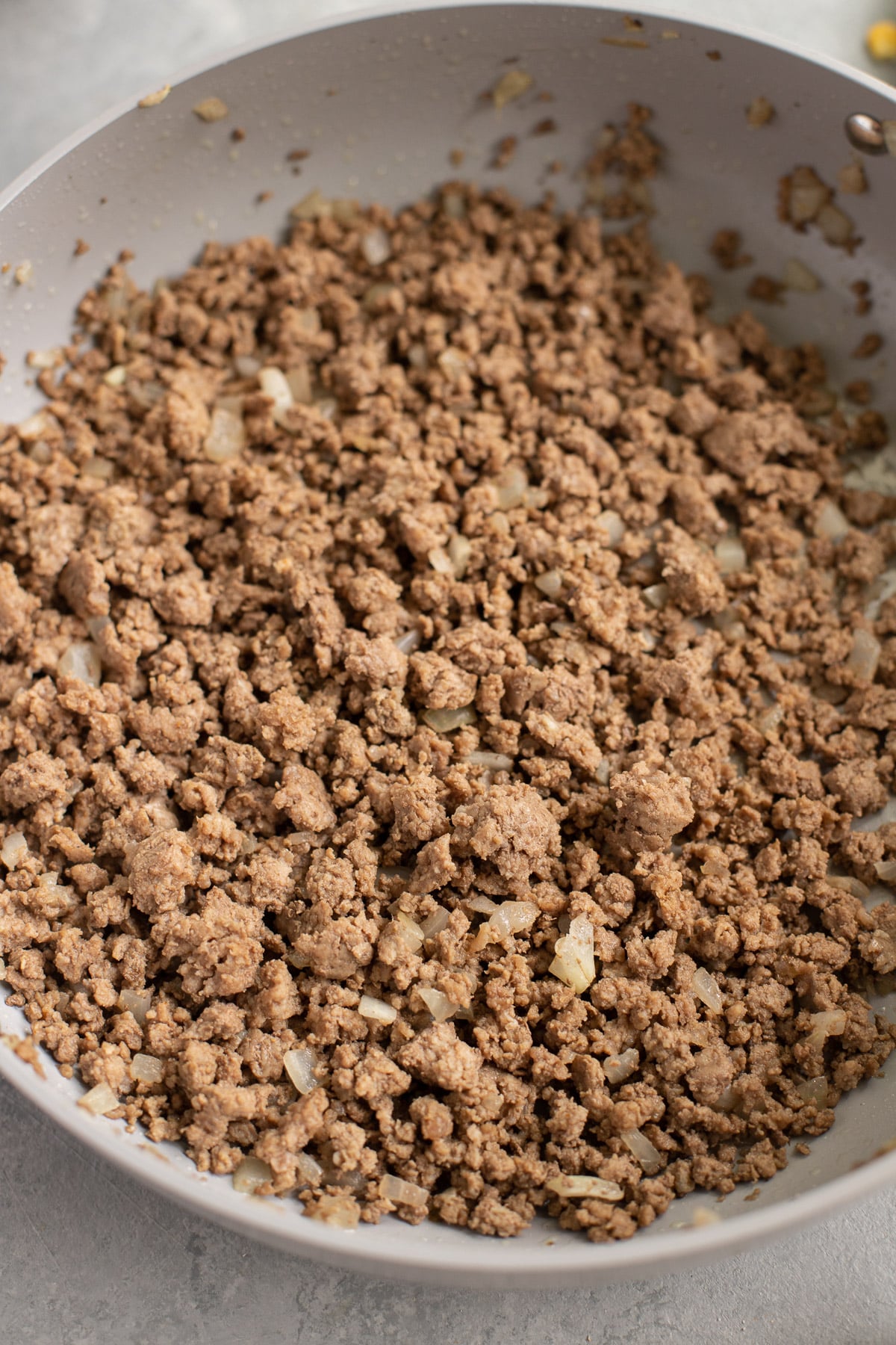Seasoned ground beef or ground turkey, onion, and garlic sauteed in a caraway pan (large skillet) for taco stuffed peppers