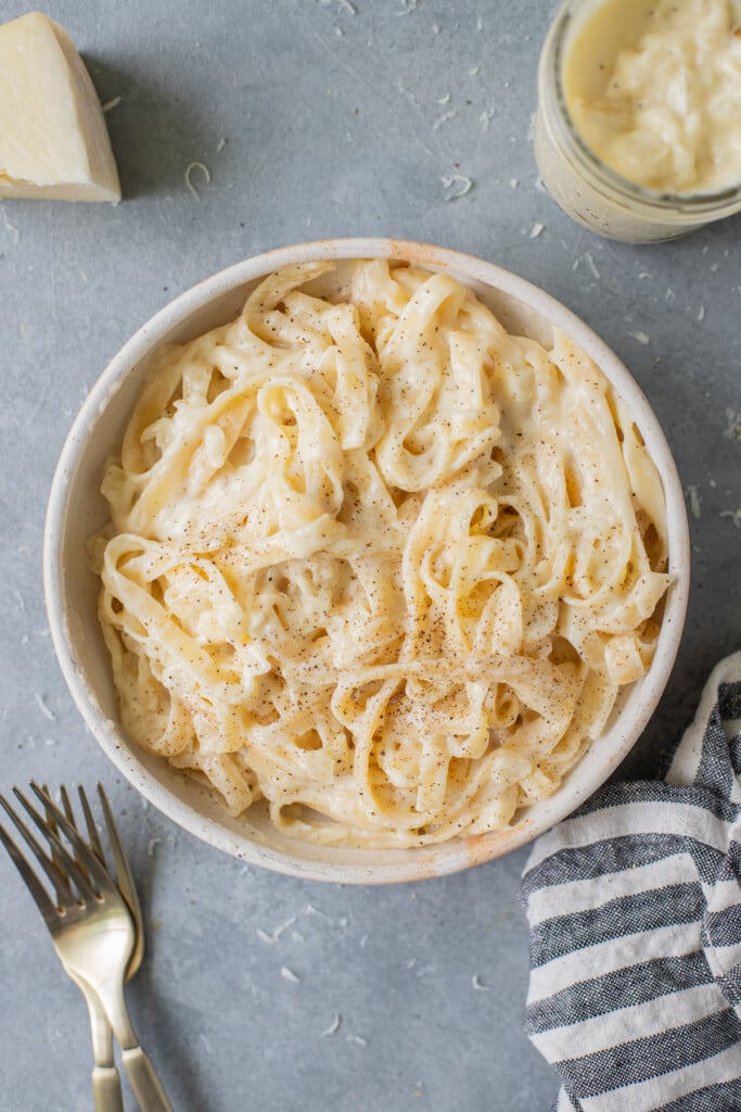 A bowl of low fat alfredo sauce recipe tossed with fettucine