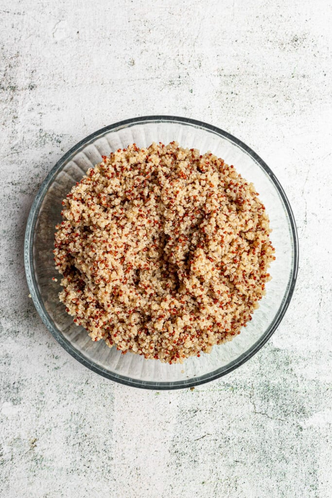 cool quinoa in a clear bowl for kale quinoa salad