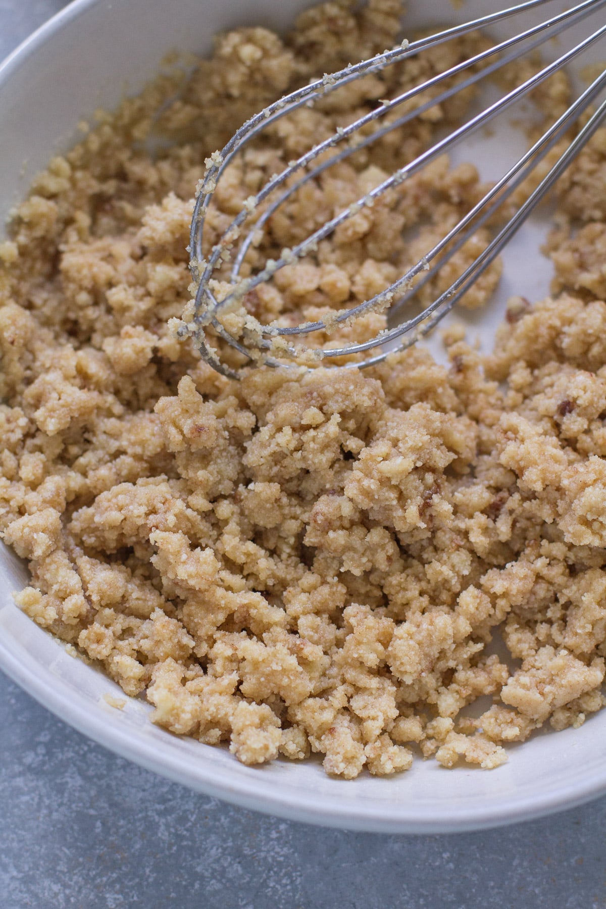 Batter for healthy lime cheesecake crust being mixed together