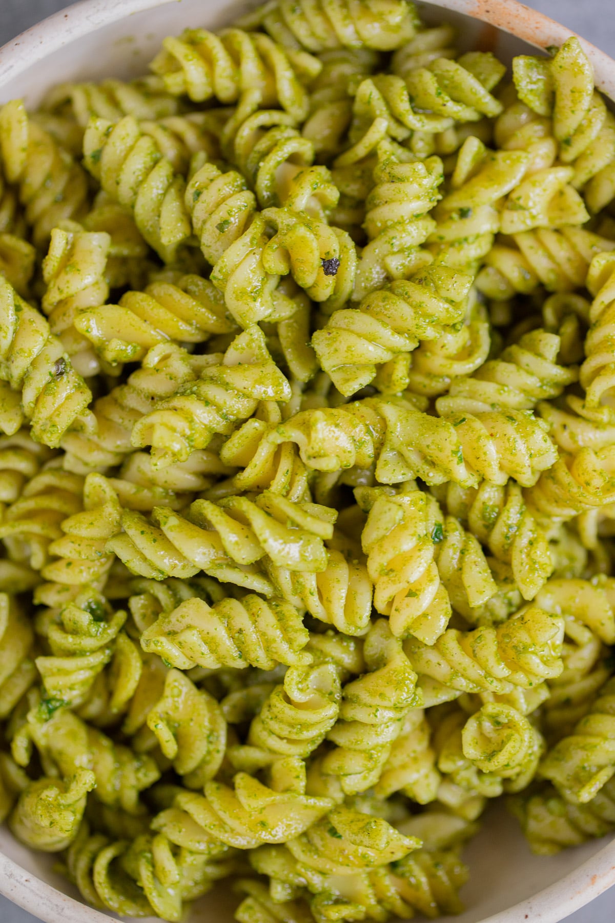 A close up of pasta with nut free pesto