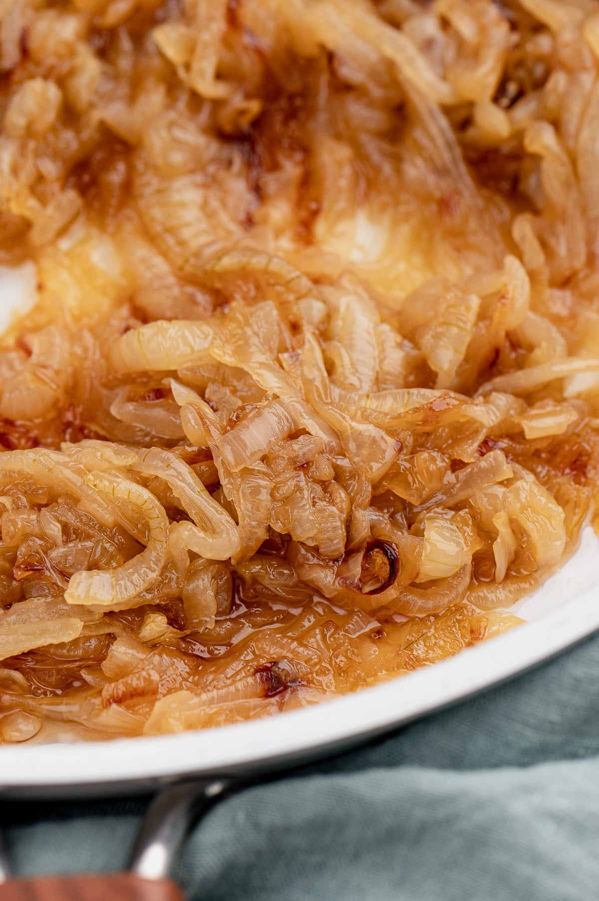 A close up of caramelized onions in a pan