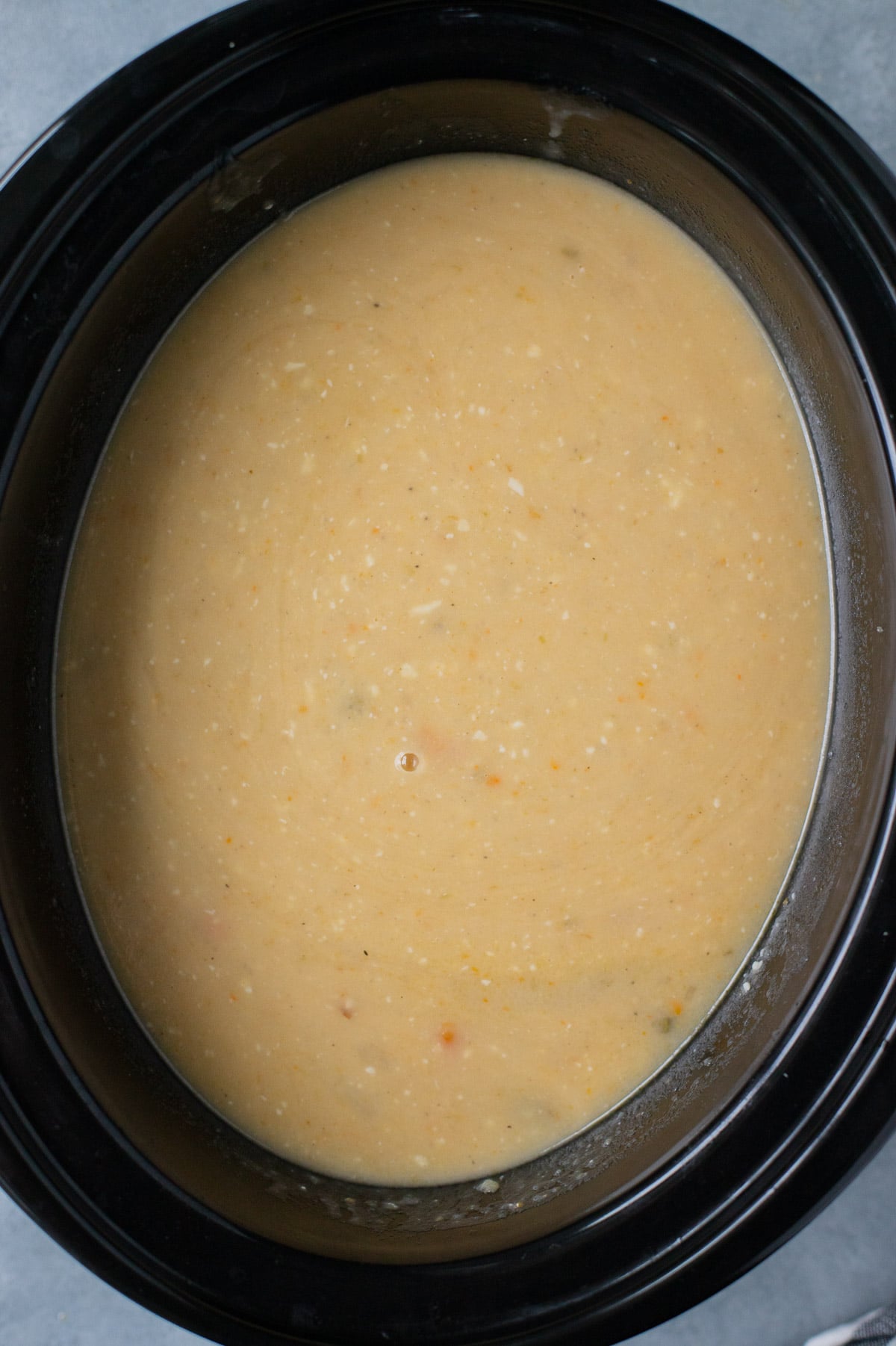 Crock Pot potato soup in a slow cooker after being blended