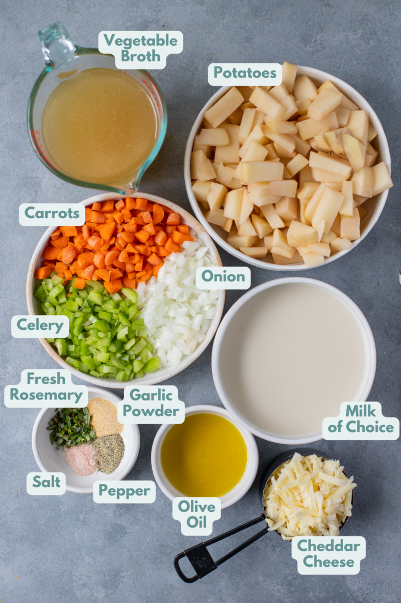 Ingredients for crockpot potato soup in white bowls: olive oil, onions, carrots, celery, potatoes, vegetable broth, grated cheddar cheese, garlic powder, fresh rosemary, salt and pepper, milk