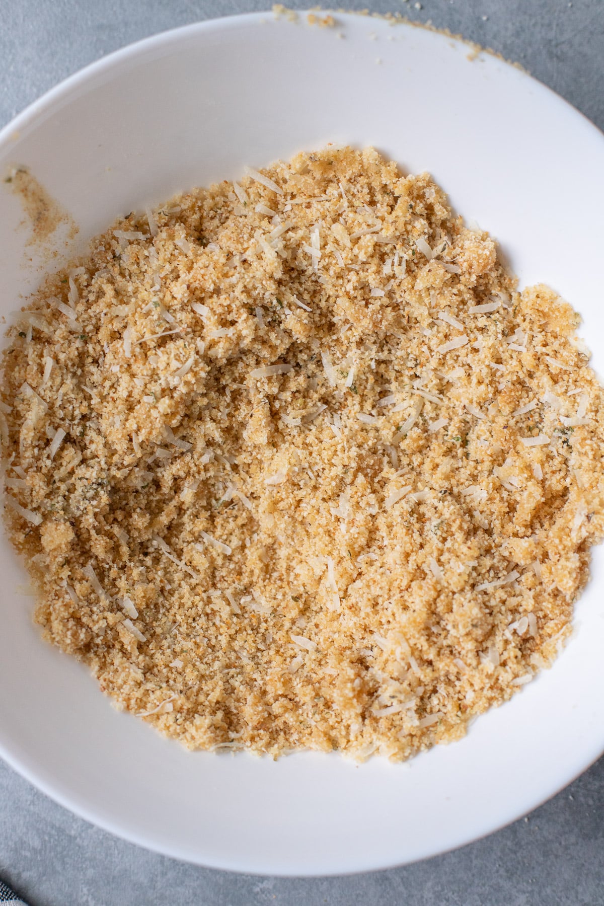 A white bowl of the breading topping for healthy mac and cheese