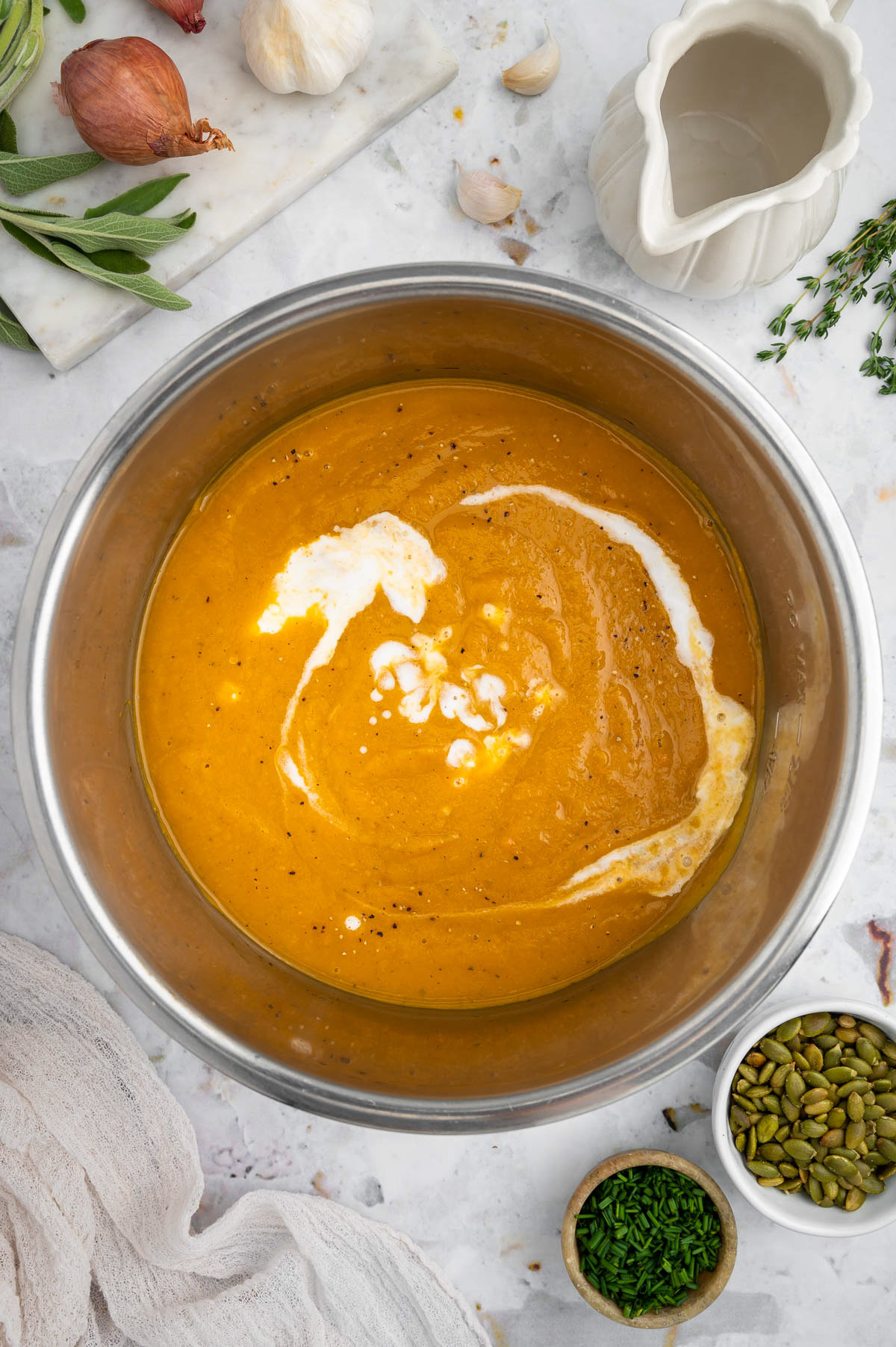 instant pot butternut squash soup in an instant pot with coconut milk being added before being stirred