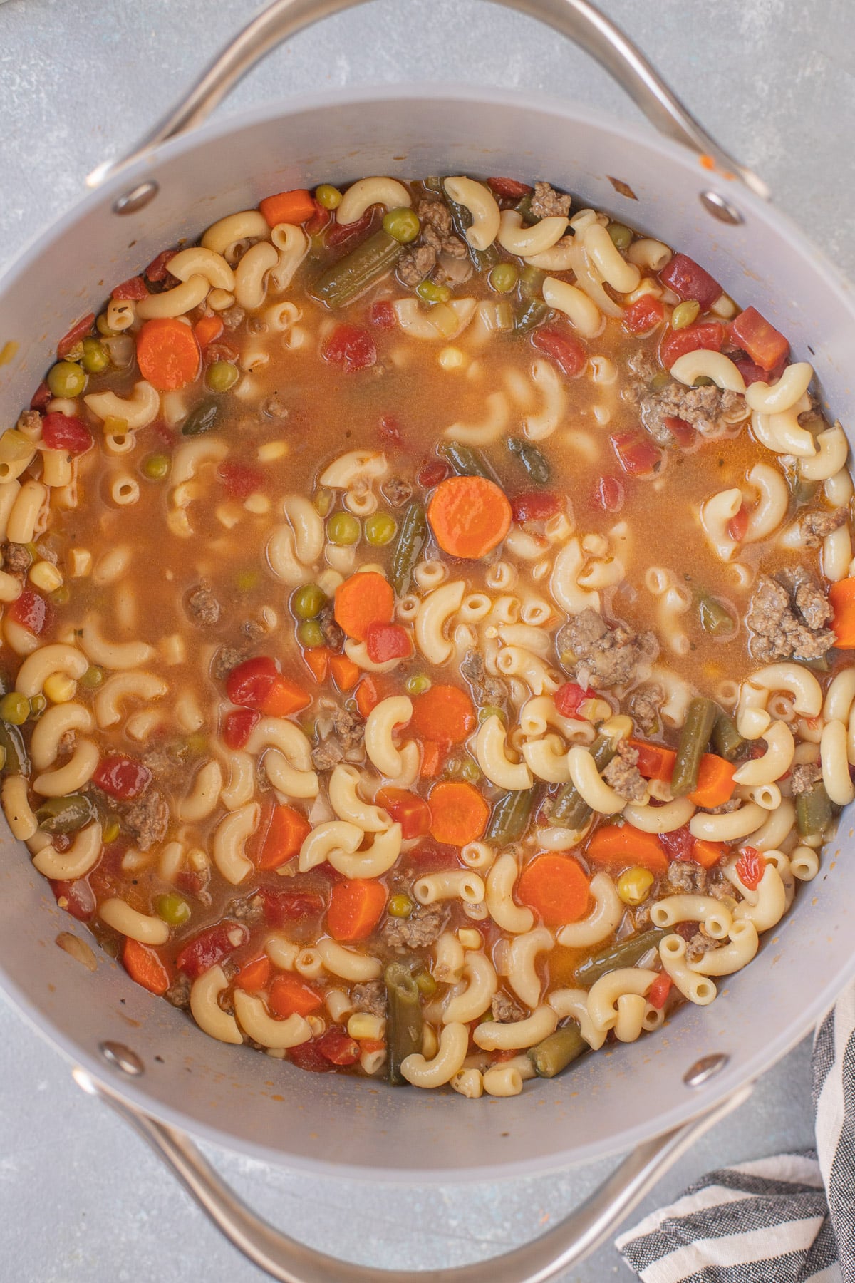 An overhead shot of a pot of hamburger vegetable soup