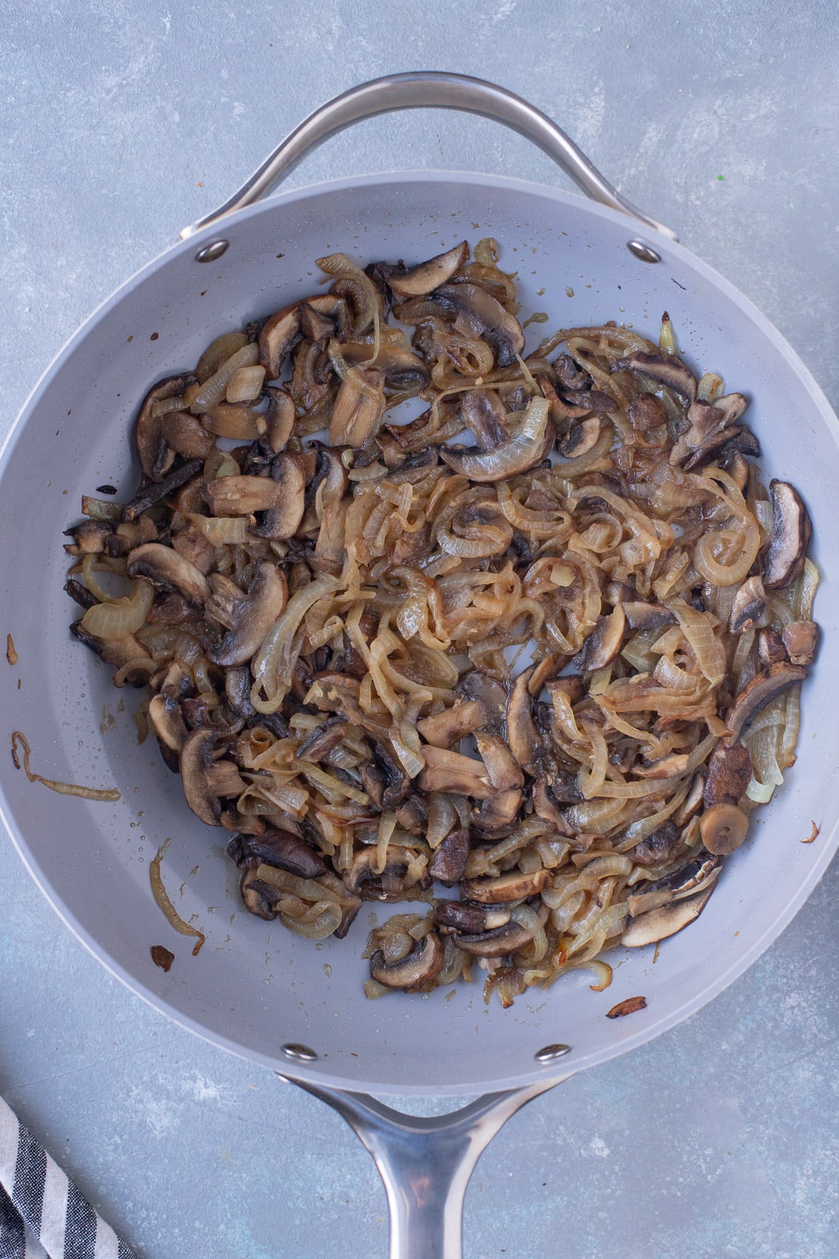 Caramelized onions and mushrooms in a pan for french onion pasta