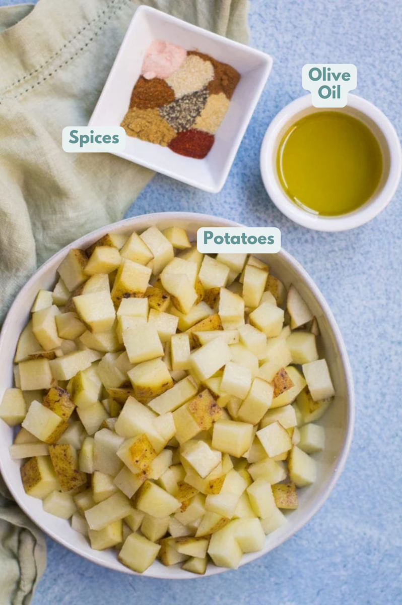 ingredients to make mexican potatoes on a blue background