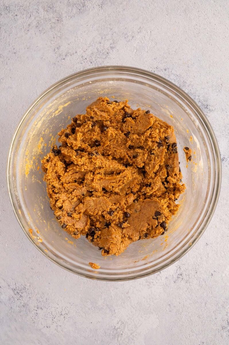 Protein Cookie dough in a clear bowl.