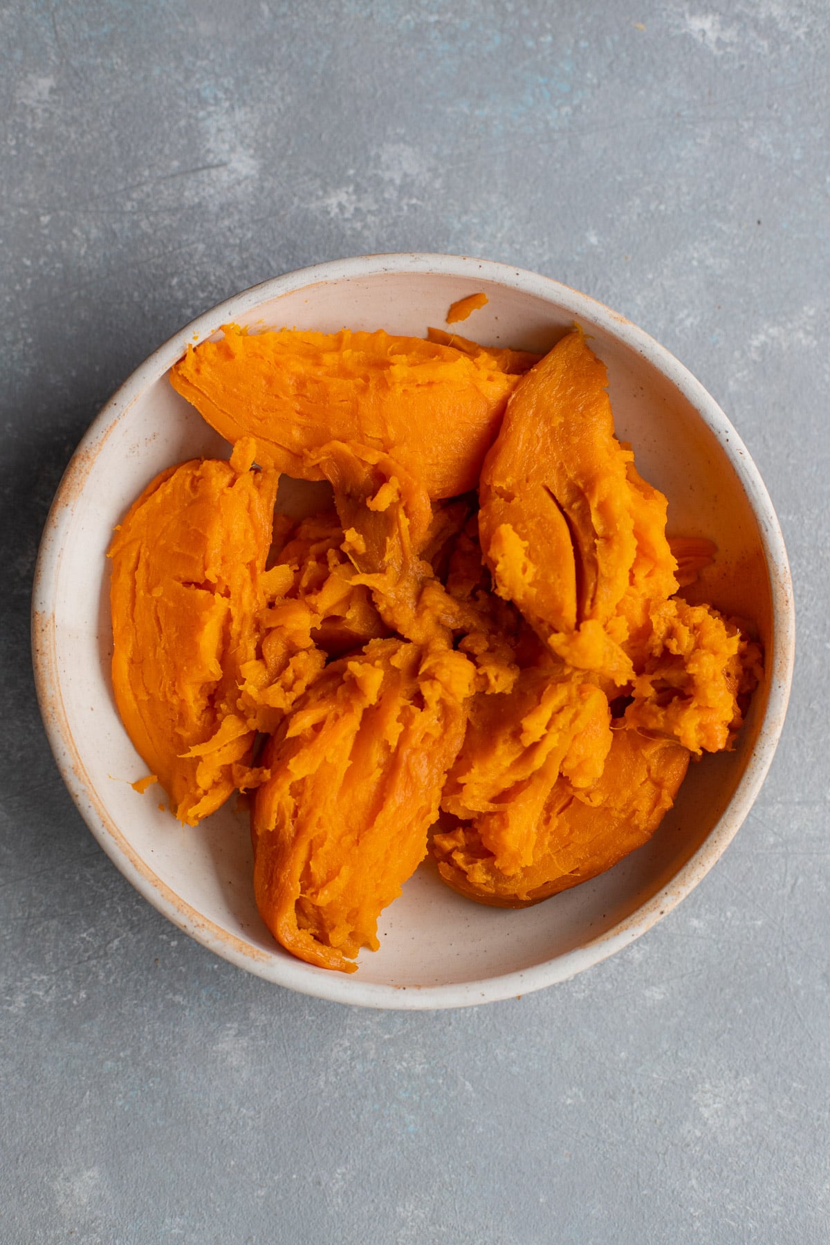 Mashed sweet potato in a bowl.