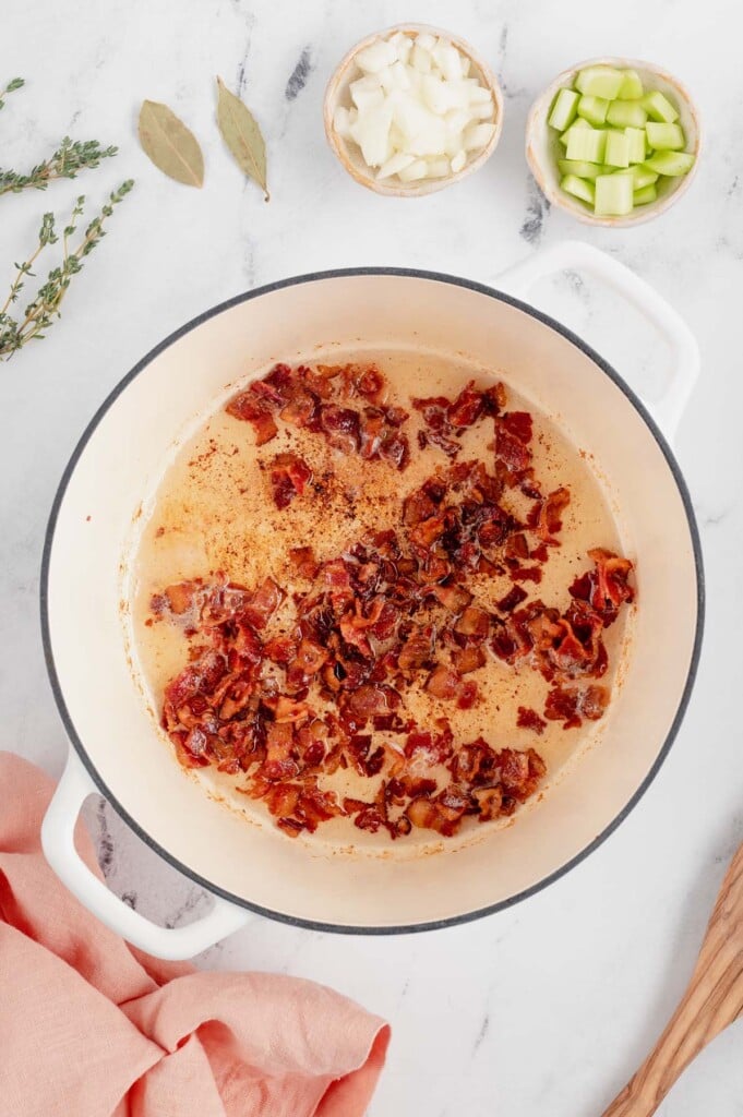 Bacon cooking in a dutch oven for chicken corn chowder
